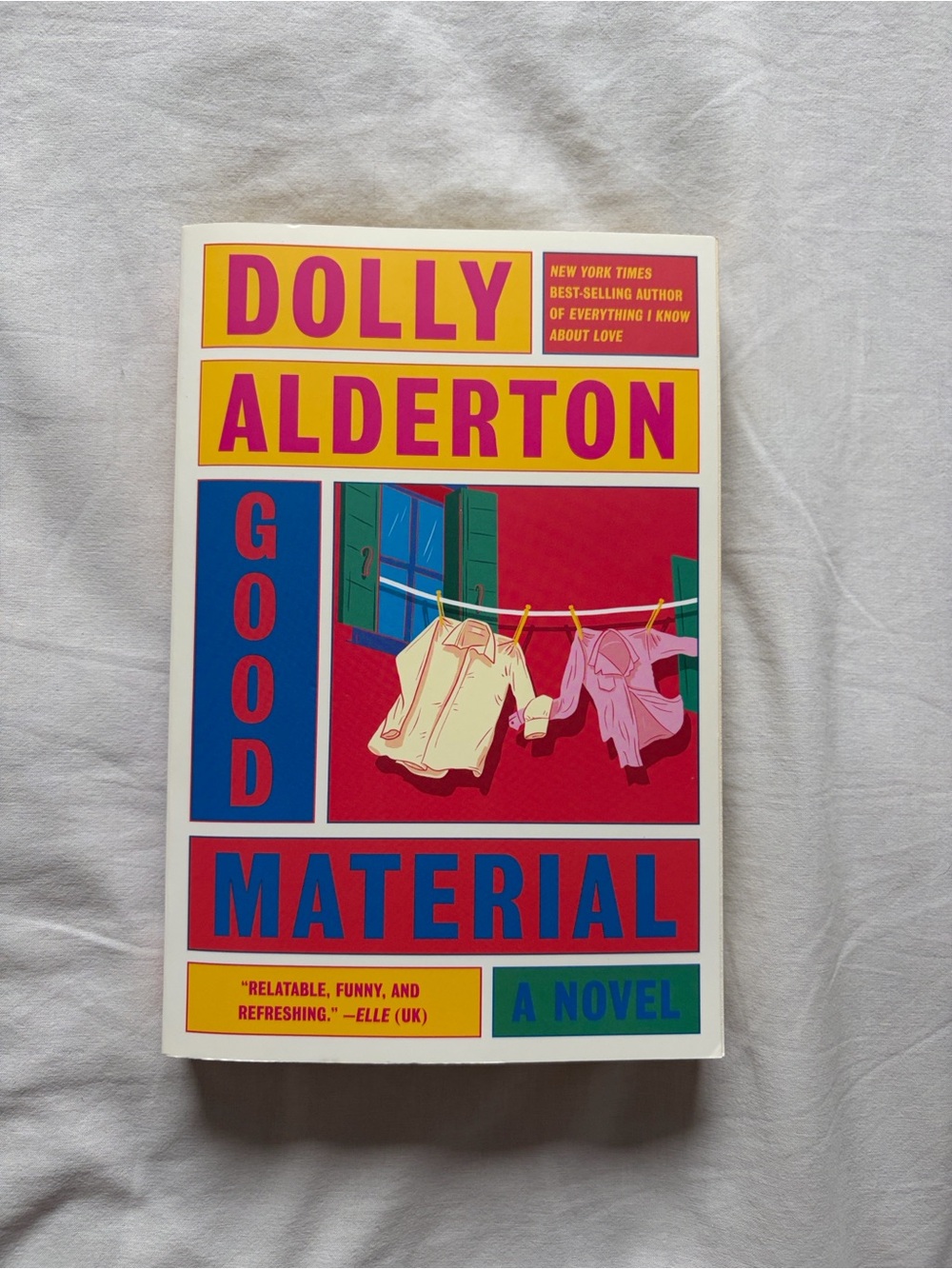 Good Material by — Paperback Novel in Pink and Cream Cover
